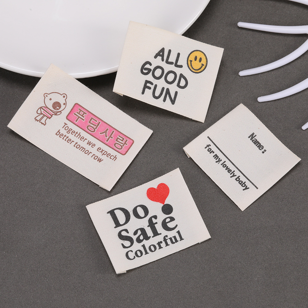 カスタムプリントプライベートロゴラベル、縫い付けコットンラベ - Baby Clothing Organic のレビューと価格
